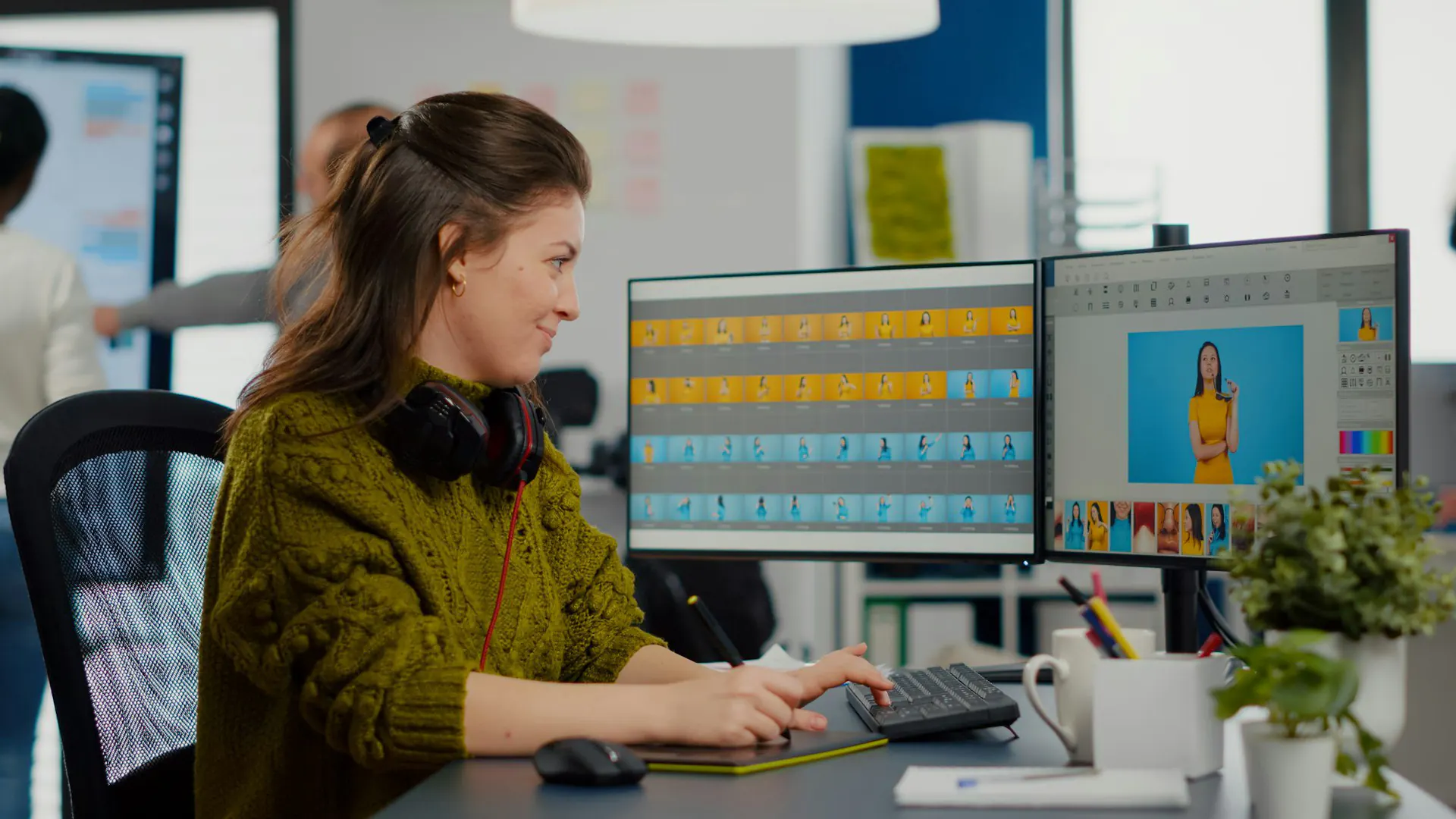 Specialist reviewing website performance across multiple screens