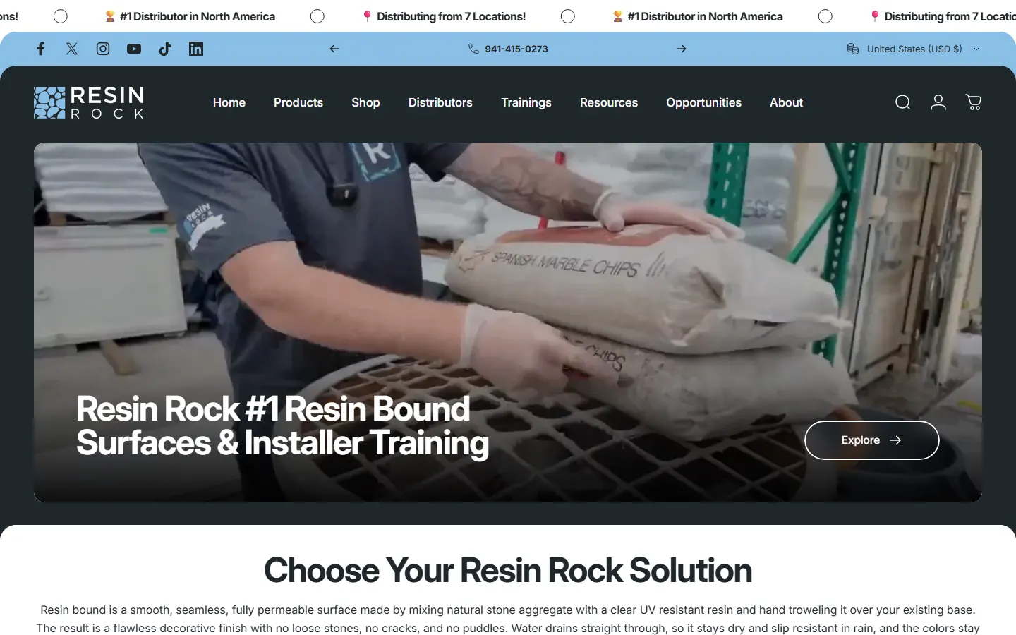 The ResinRock homepage, with its product menu and a video of a warehouse team loading marble chips